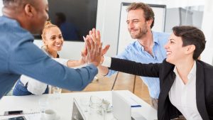 Group of People Celebrating Dental Practice Start-Up Success